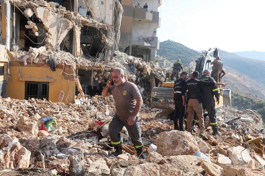 lebanese-rescuers-scour-site-of-deadly-israeli-strike-as-hezbollah-fires-missiles