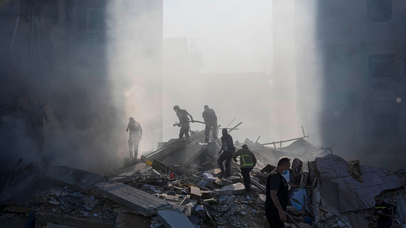 Middle East latest: Workers search through rubble in eastern Lebanon where Israeli strike killed 13