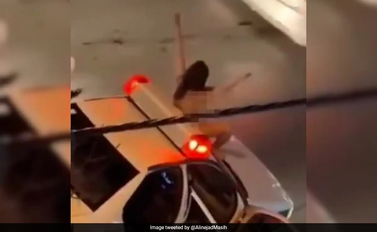 video-shows-naked-iranian-woman-jumping-on-police-car-in-bold-protest