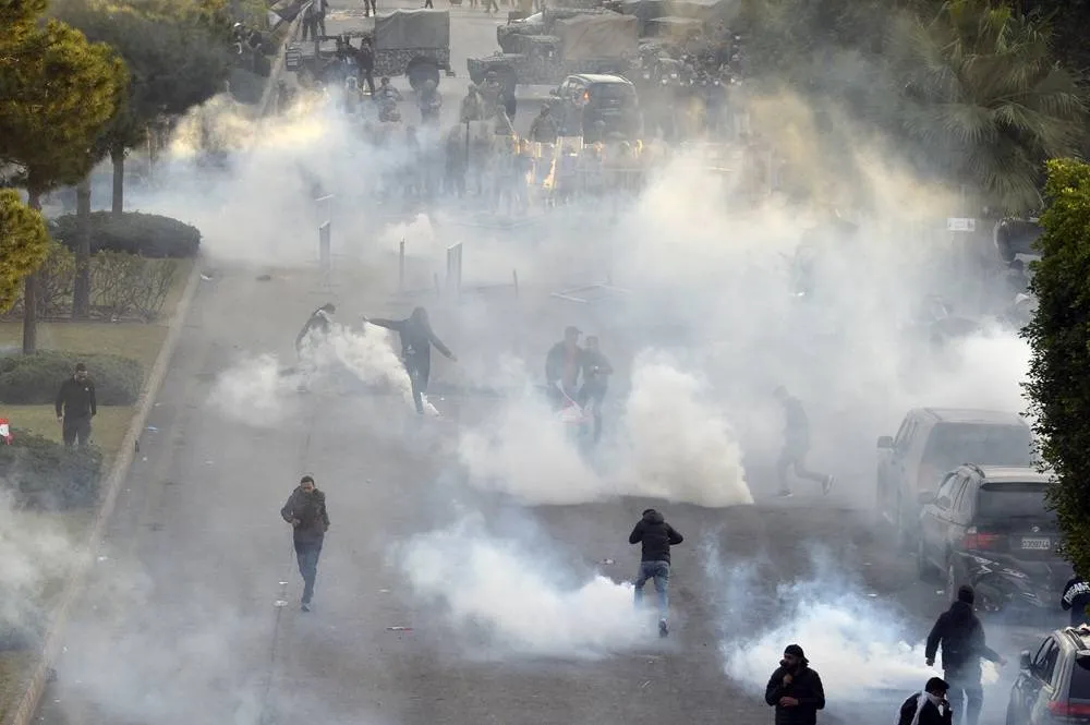 tear-gas-fired-at-hezbollah-supporters-protesting-lebanon-blocking-iranian-flight